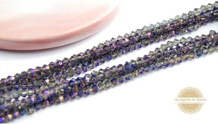 Perles toupies à facettes 3x3.5mm violettes irisées