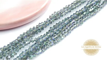 Perles toupies à facettes 3x3.5mm bleues irisées